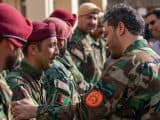 Yasin Zia greeting Afghan troops